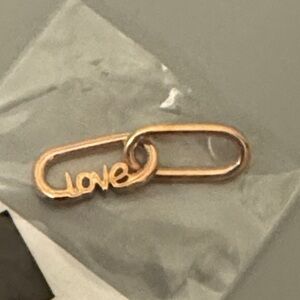 NWT Pandora 14KT Rose Gold Plate Love Script charm.